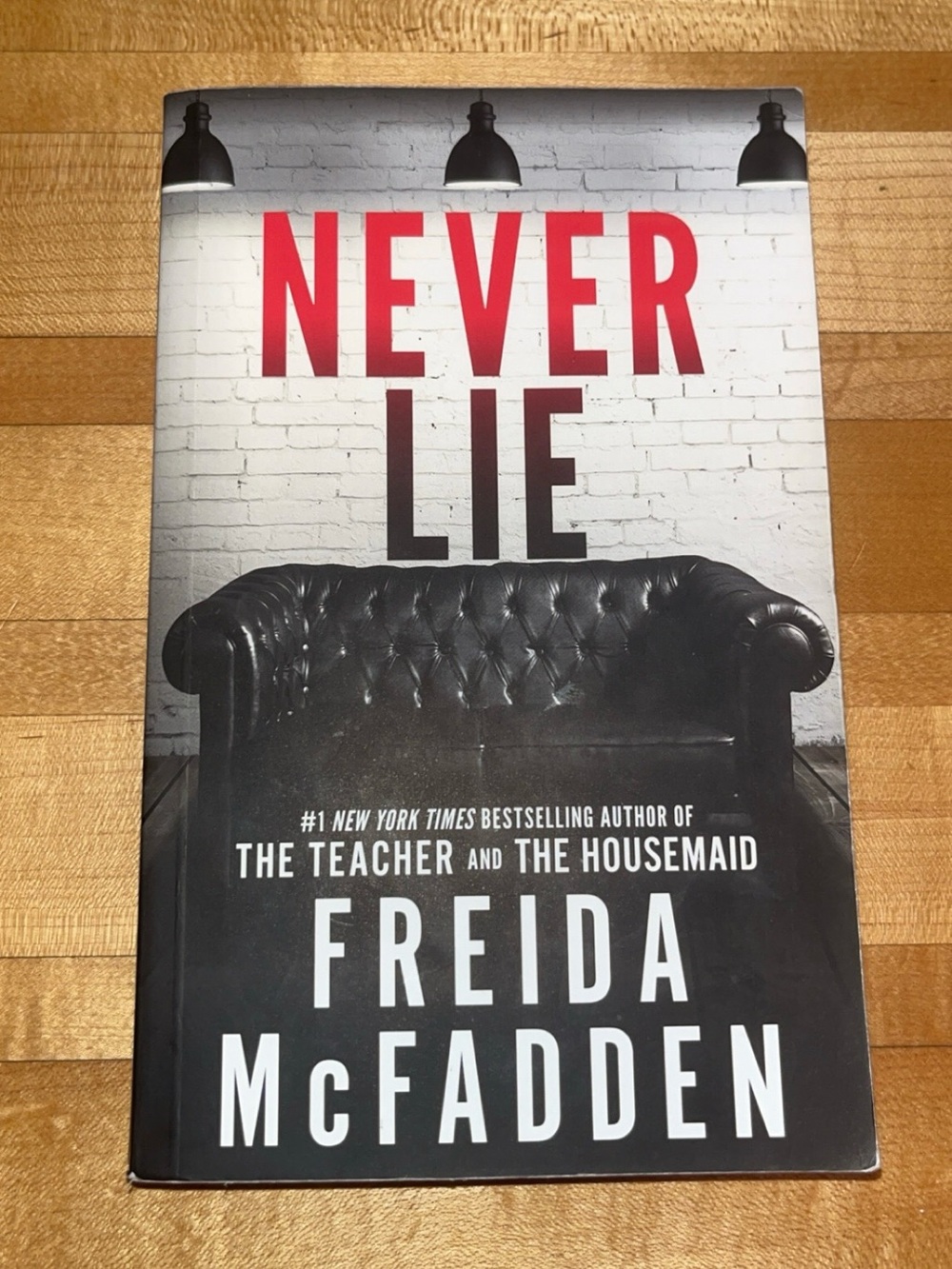 Never Lie by Freida McFadden - Black, White & Red Paperback
